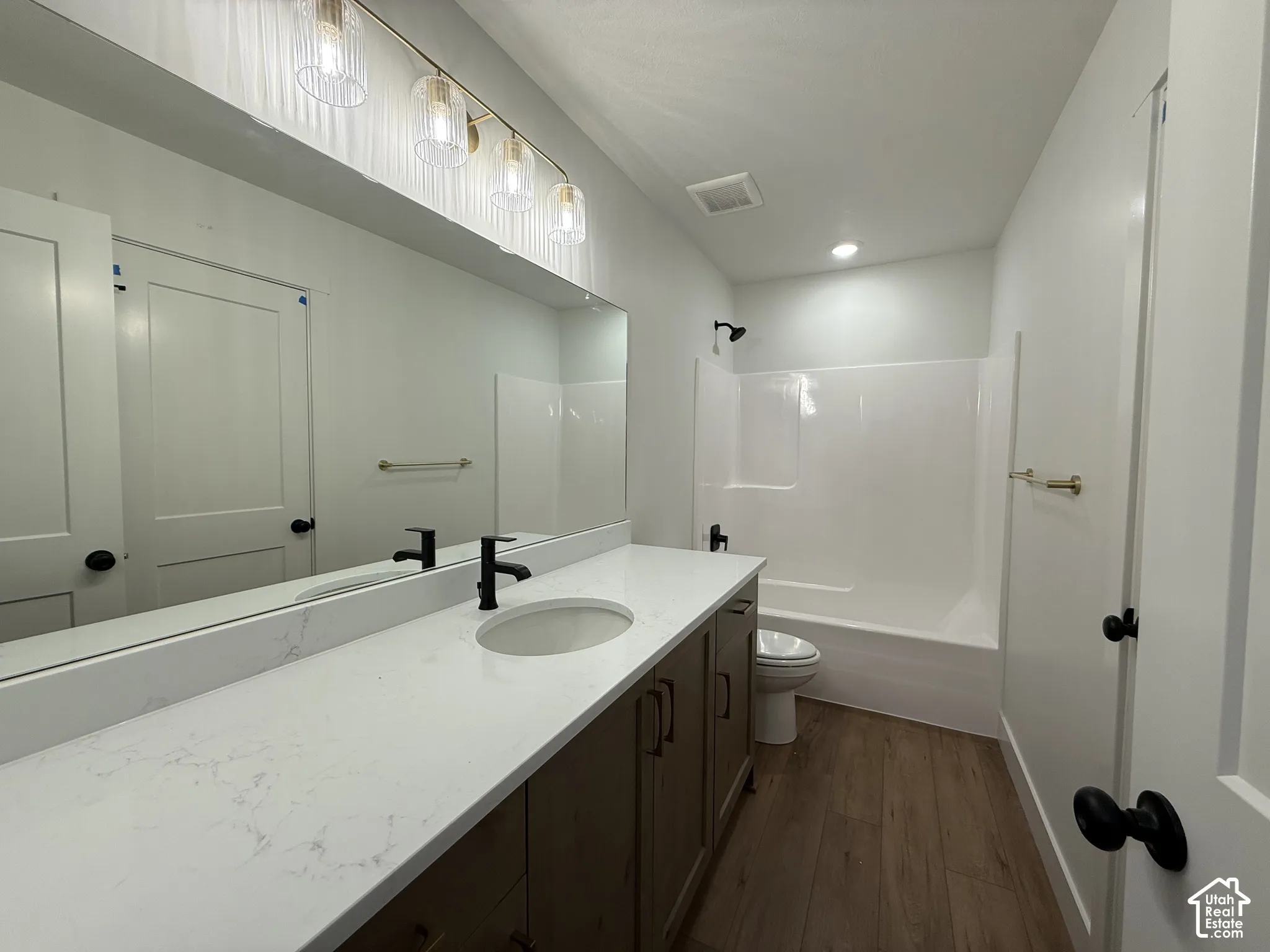 Extended vanity with dual sinks and quartz countertop