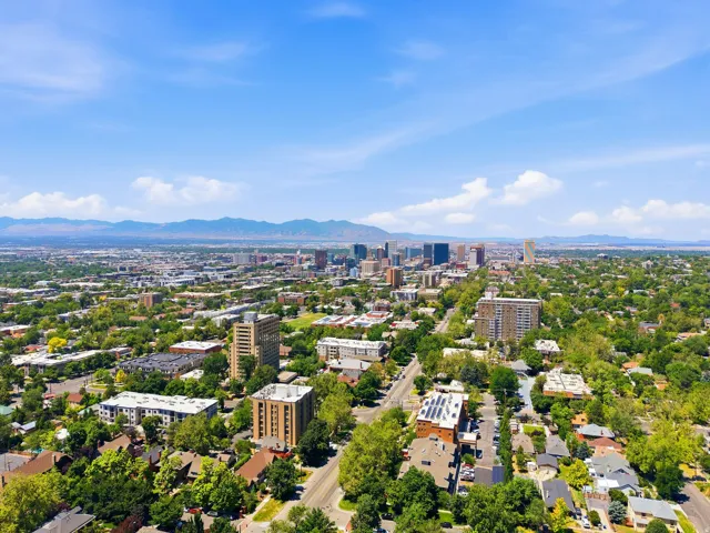 Expansive aerial perspective showcasing a metropolitan area with a prominent skyline