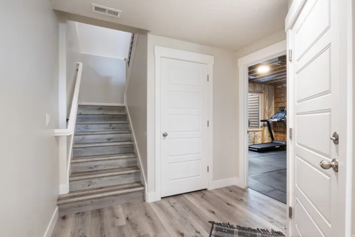 Wood-finish flooring throughout the main level and staircase