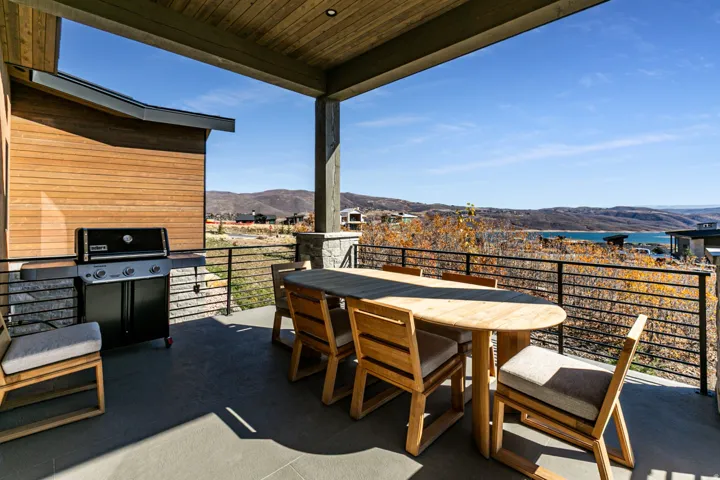 Covered outdoor patio featuring a wood plank ceiling and recessed lighting