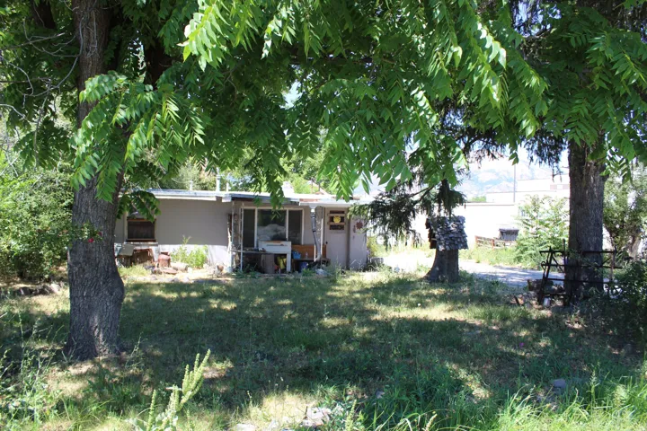 Ground-level structure with a light-toned exterior siding