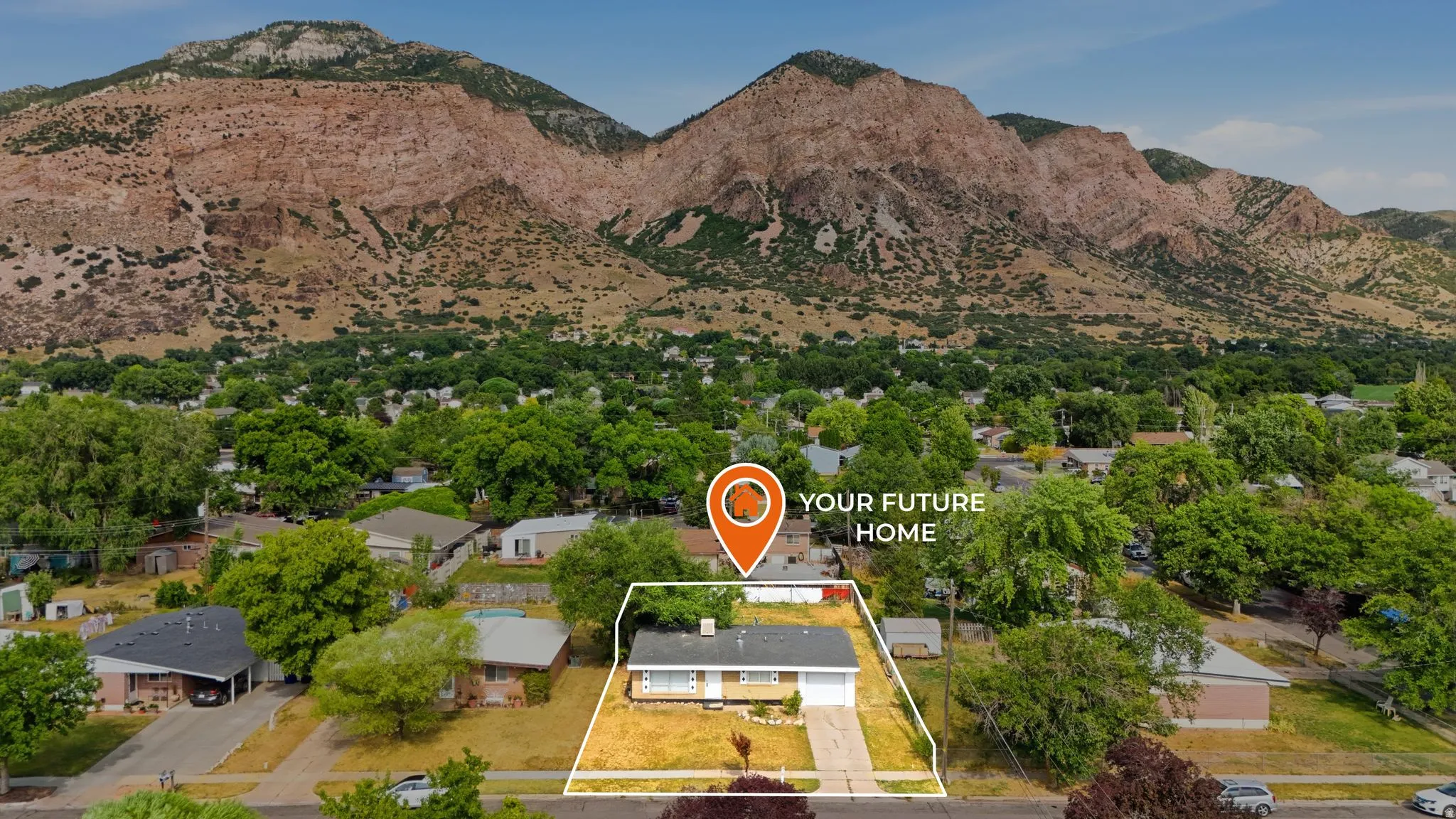 Single-story residence set against a prominent mountain backdrop