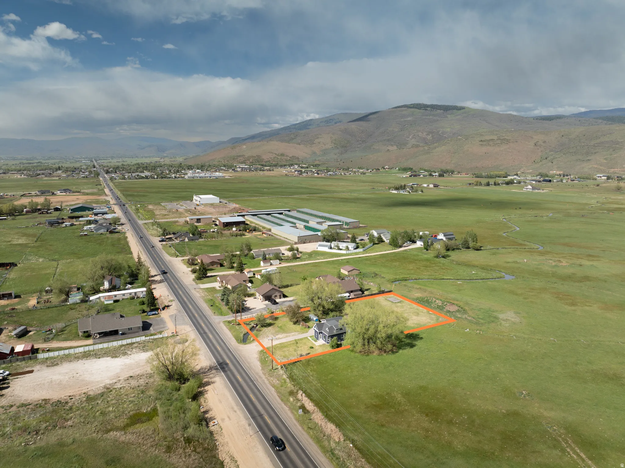 Single-family residence with a defined lot, situated along a paved road