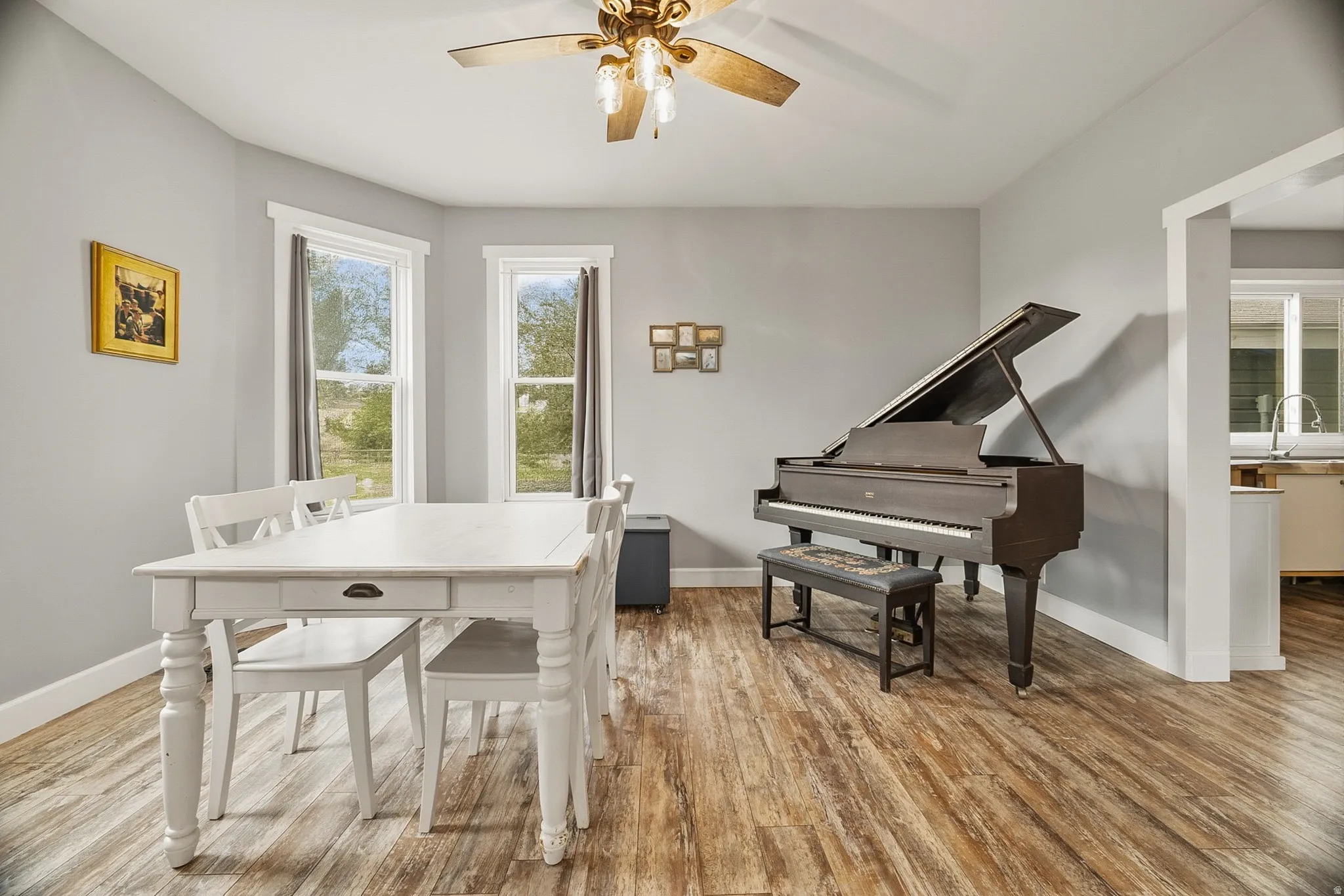 Spacious room featuring wood-finish flooring and light gray wall paint