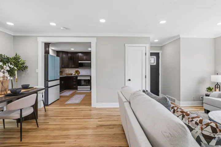 Hardwood flooring extends throughout this open-concept living space