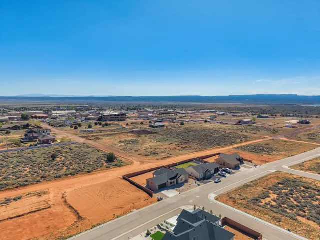 Aerial perspective showcasing a developing residential area with paved streets