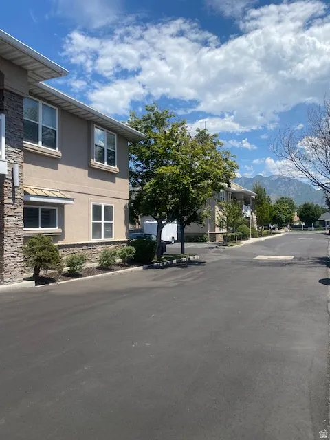 Exterior features stucco siding with stone veneer accents
