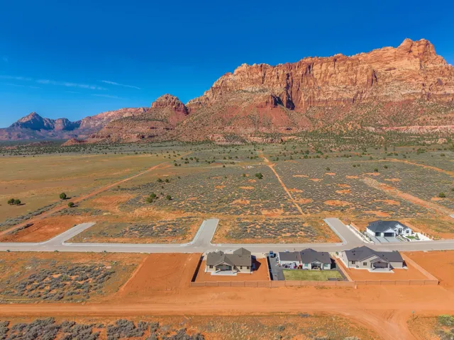 Expansive desert landscape featuring a prominent mountain backdrop