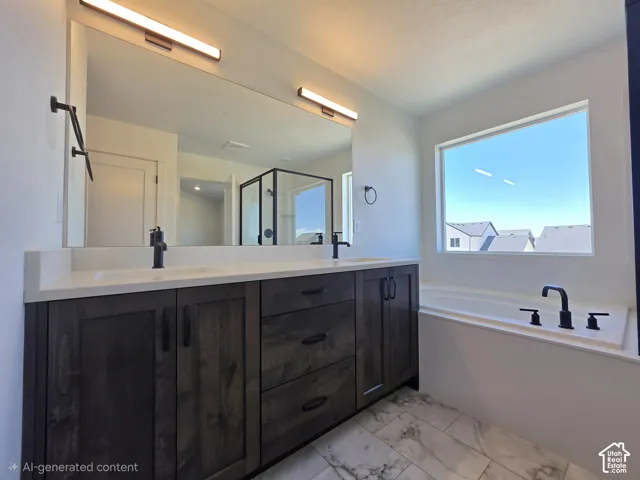 Bathroom featuring a double vanity with dark wood-finish cabinetry, light-colored countertops, and dual rectangular undermount sinks
