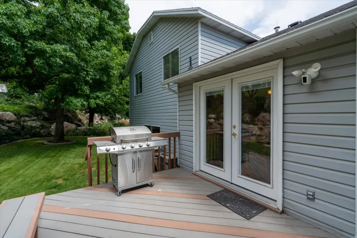 Exterior deck featuring composite decking and a wooden railing