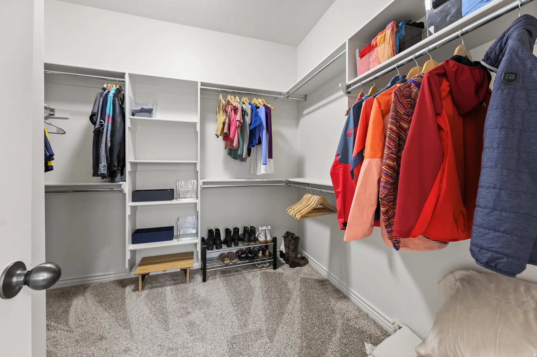 Primary bedroom walk in closet