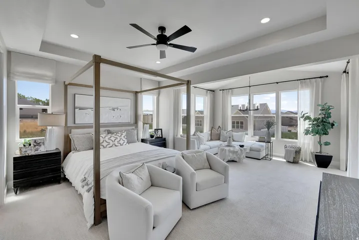 Spacious room featuring multiple windows, a coffered ceiling, recessed lighting, and a ceiling fan