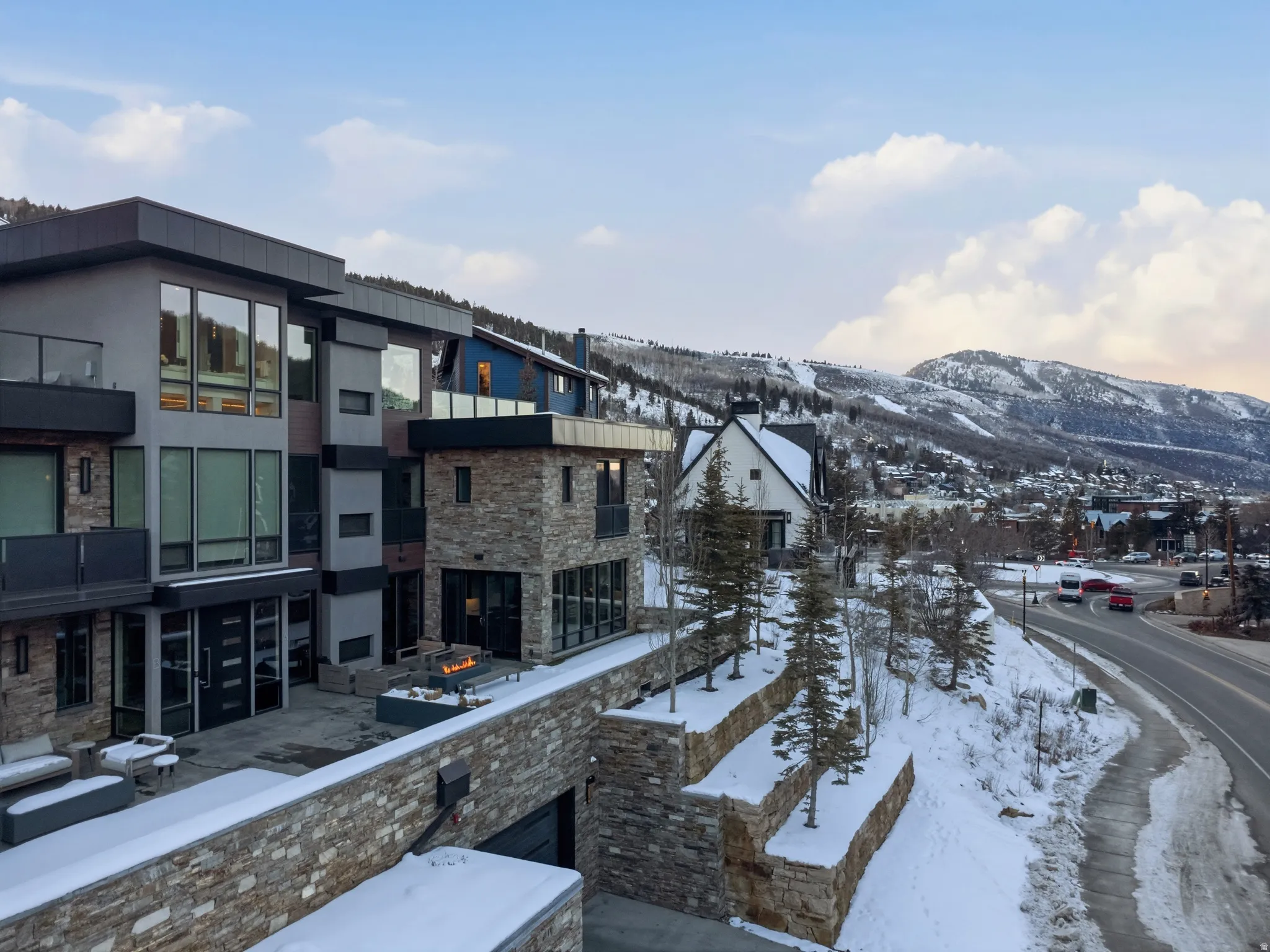 Contemporary multi-level residence featuring stone and paneling facade