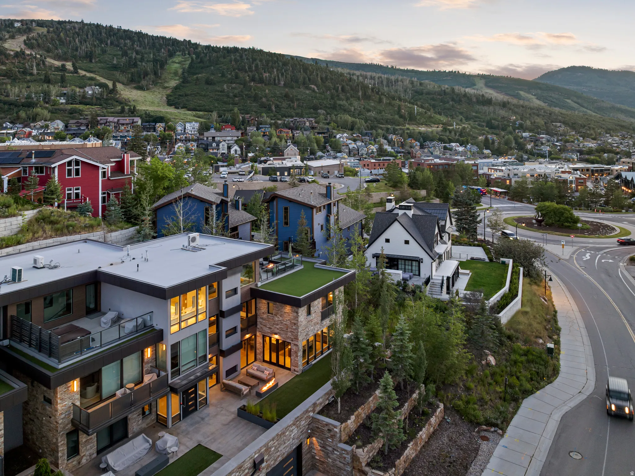 Modern multi-level residence featuring stone accents and expansive windows
