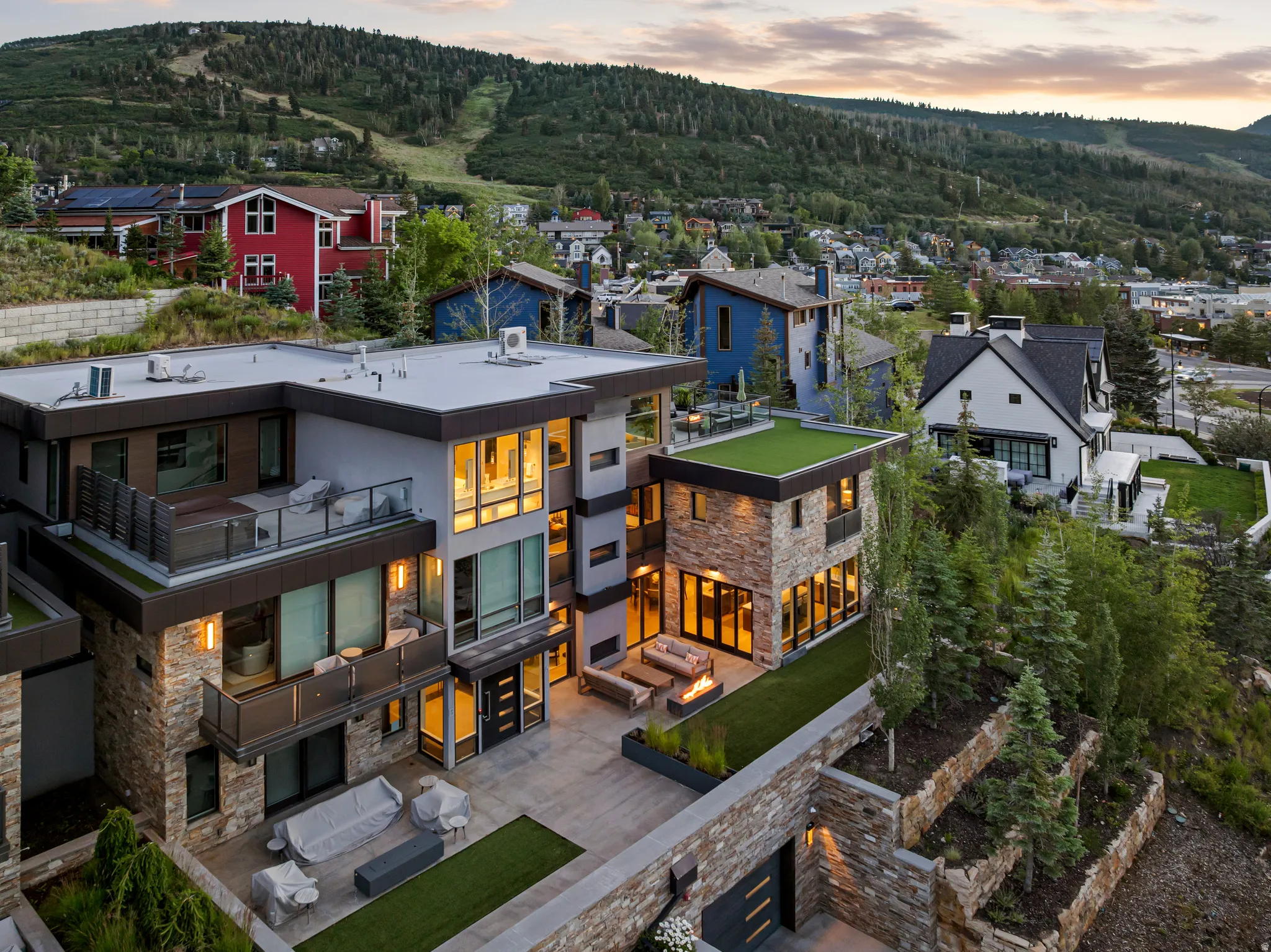 Modern multi-level residence featuring stone and stucco exterior finishes