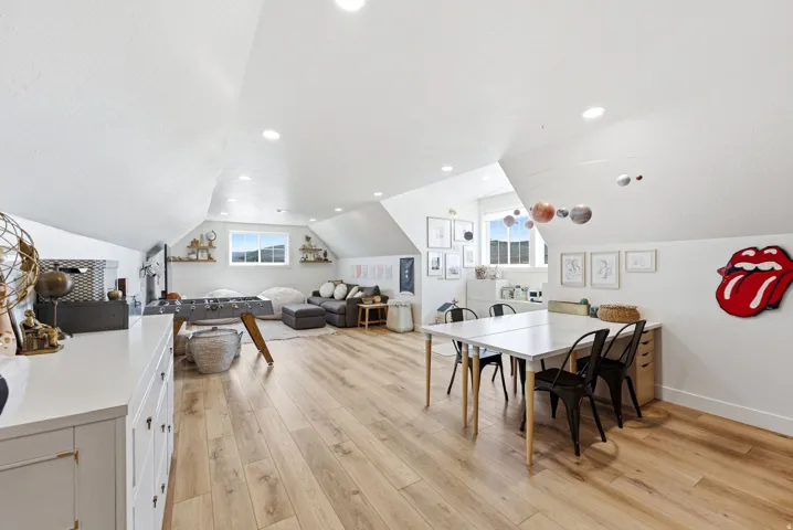 Spacious attic conversion featuring wood-finish flooring throughout