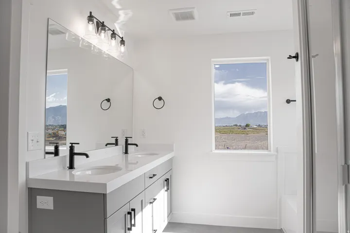 Primary bathroom featuring dual vanity