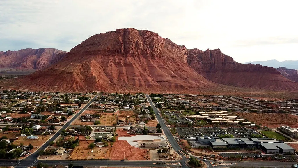 Expansive mountain backdrop with a developed residential area