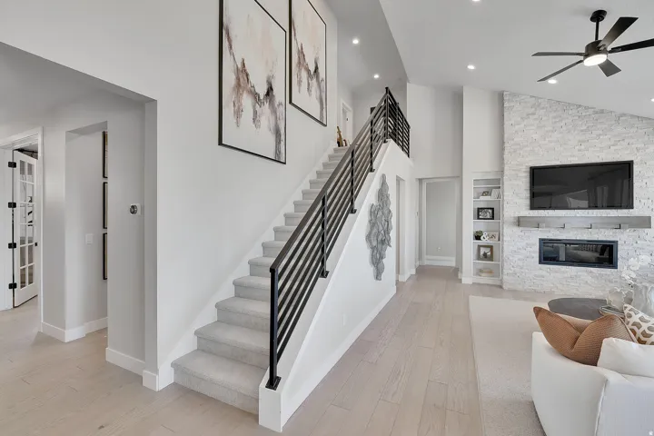 Light wood-finish flooring extending from the entryway into the living area. This is not the actual home being built but a representation of the features available in this home. Colors and finishes may differ from those shown.