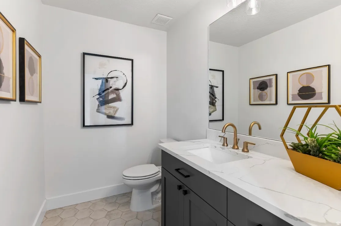 Vanity with white countertop and integrated rectangular sink