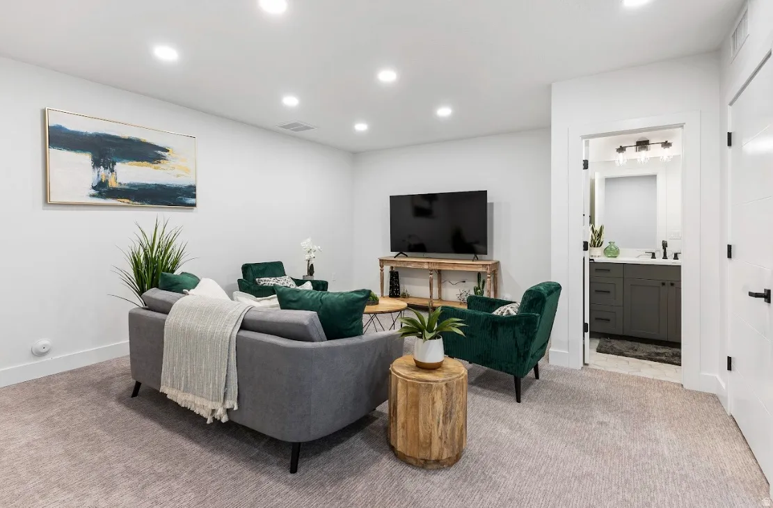 Carpeted living area featuring recessed lighting