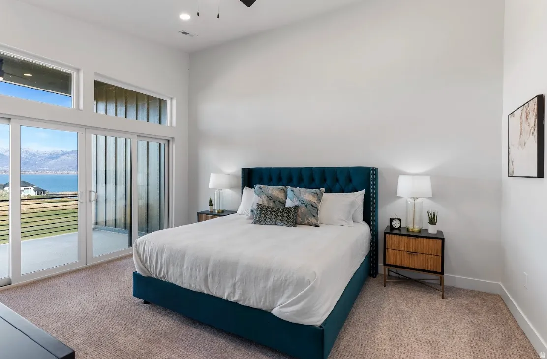 Carpeted room featuring a high ceiling, recessed lighting, and a ceiling fan