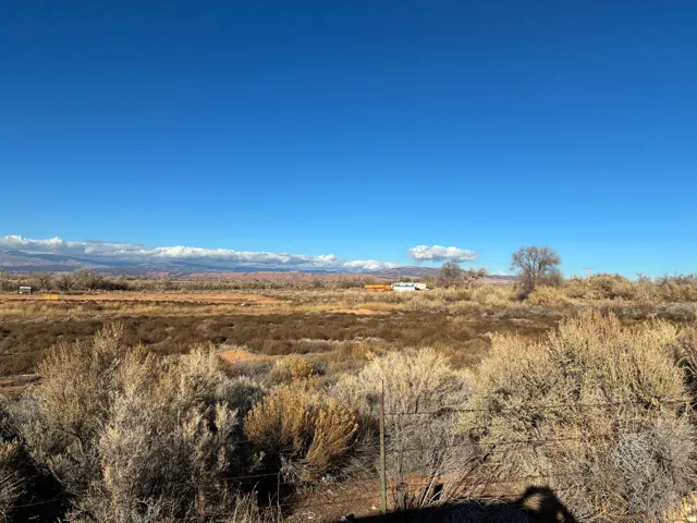Expansive natural landscape with varied low-lying vegetation