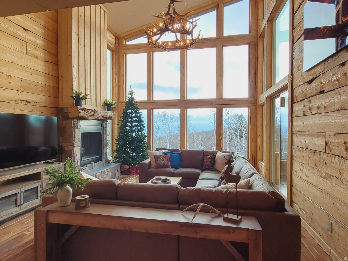 Grand living area featuring soaring ceilings and expansive windows
