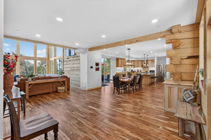 Open-concept living area with wood-finish flooring throughout