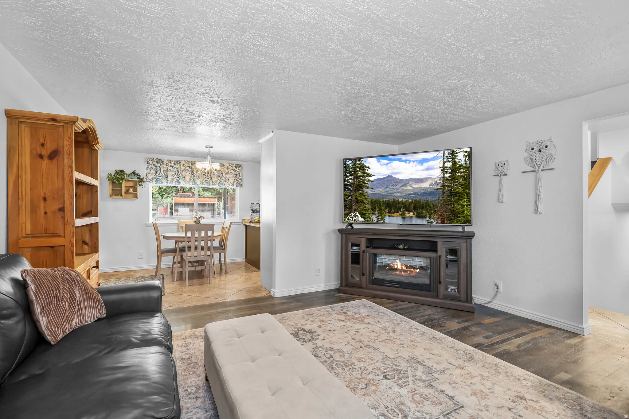 Open-concept living area with dark wood-finish flooring
