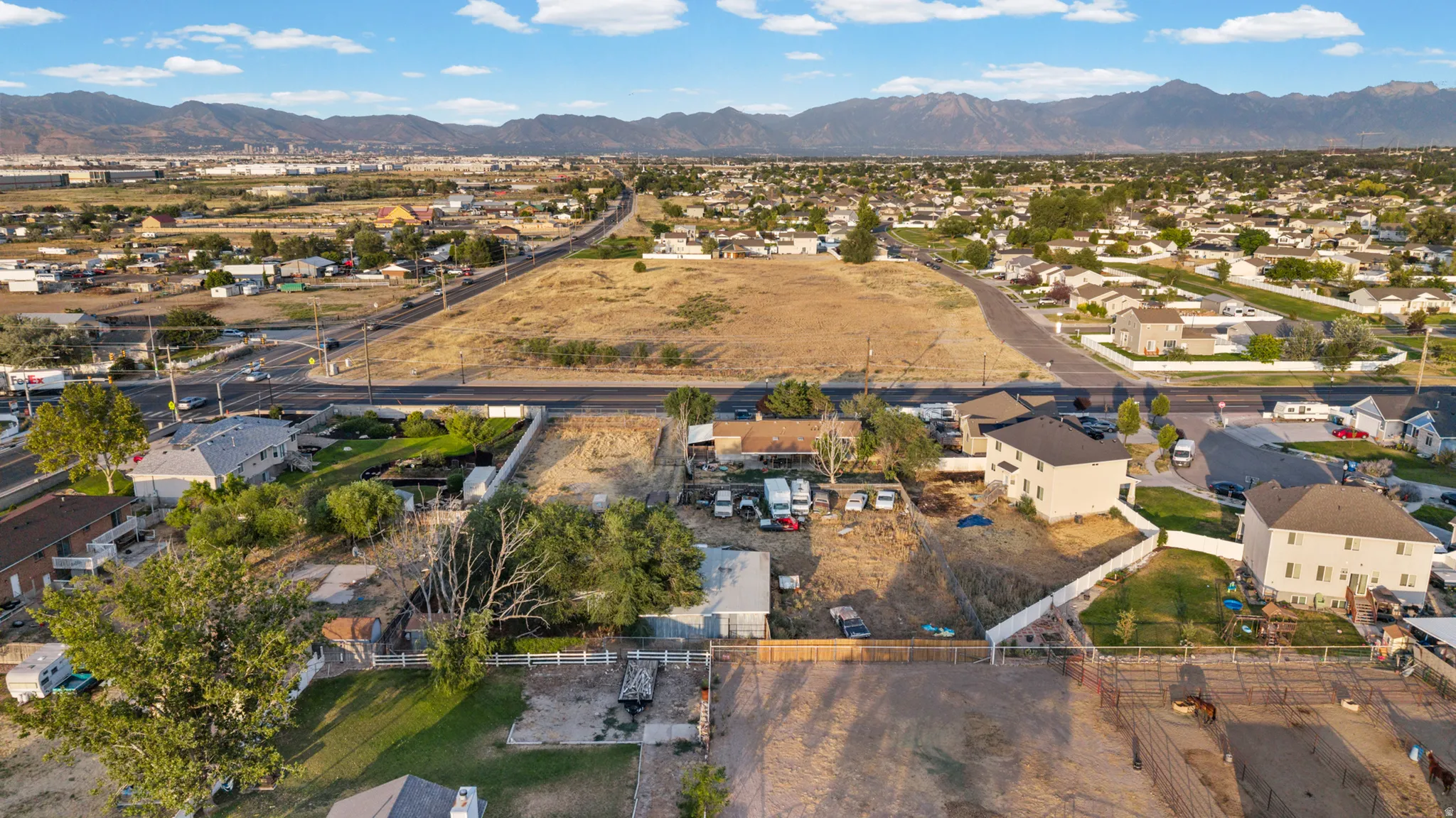 Expansive aerial perspective showcasing a neighborhood with distant mountains