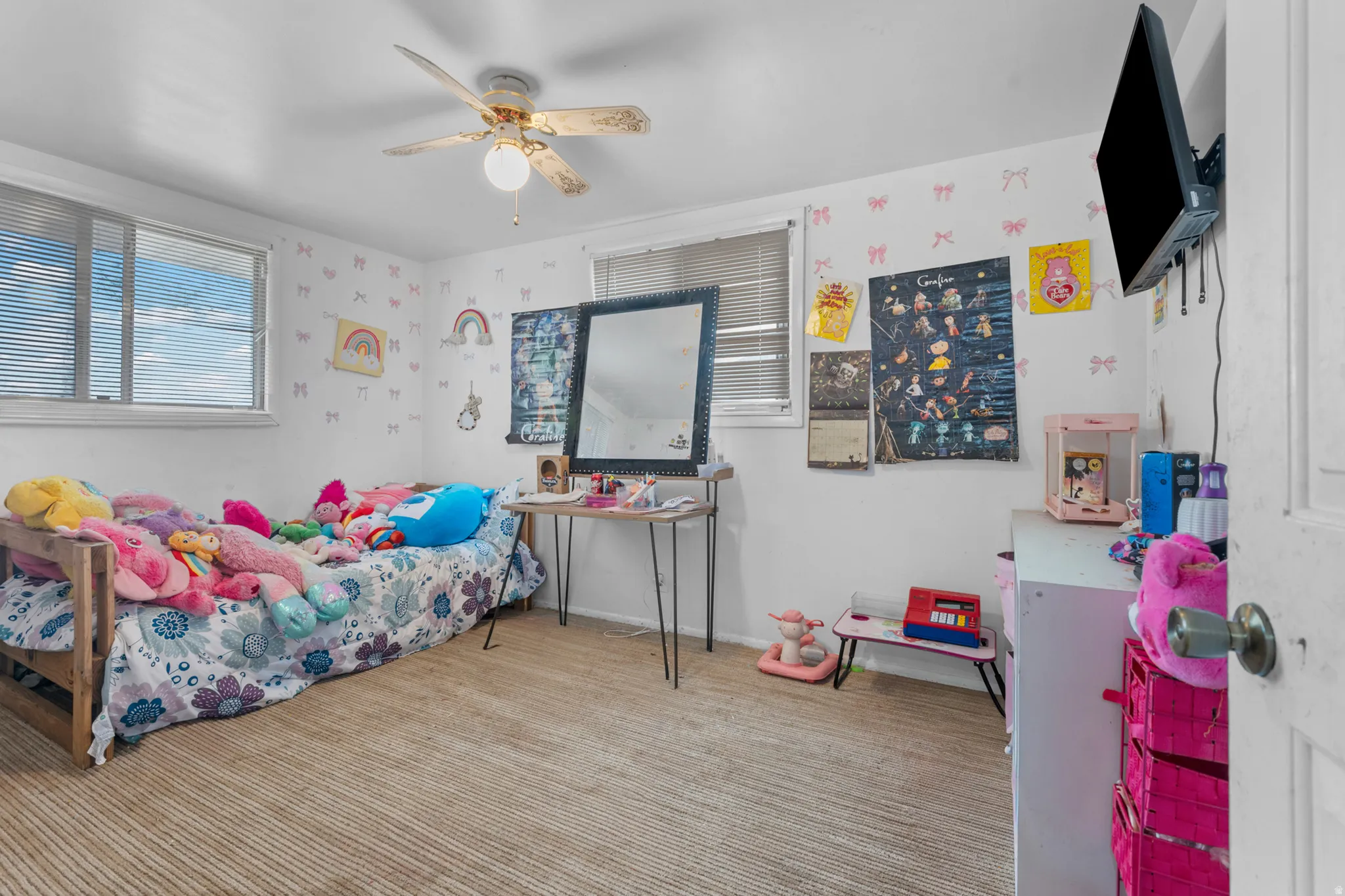 Carpeted room featuring a ceiling fan with integrated lighting, a window with horizontal blinds, and white walls