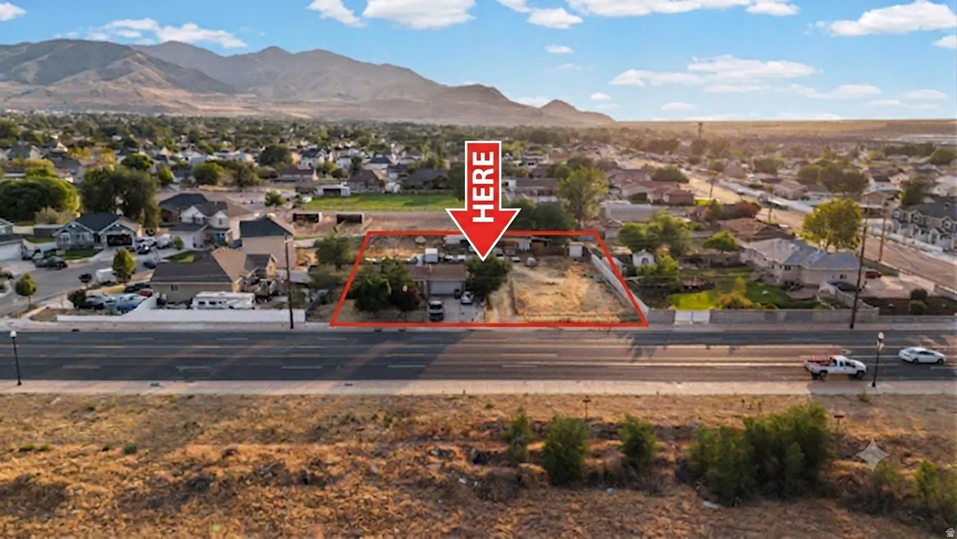 Expansive lot featuring a single-story residence and undeveloped land