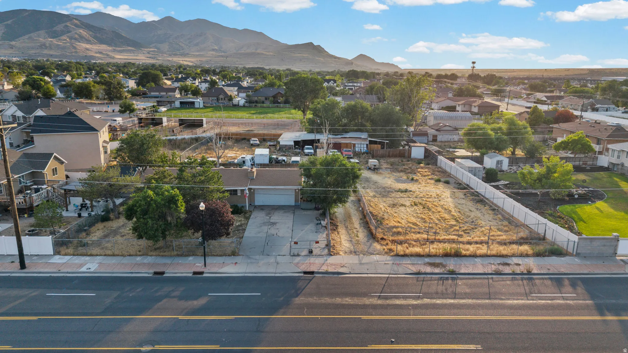 Aerial perspective showcasing a single-story residence with an attached garage
