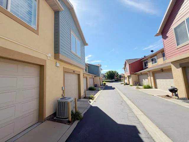 Multiple attached garages with patterned doors