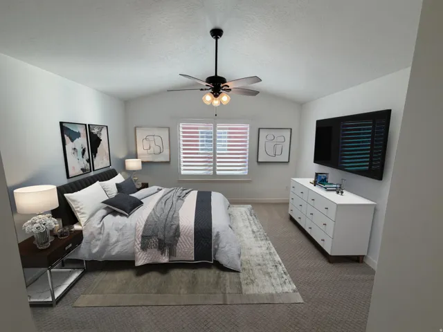 Vaulted ceiling with a black ceiling fan featuring three globe lights