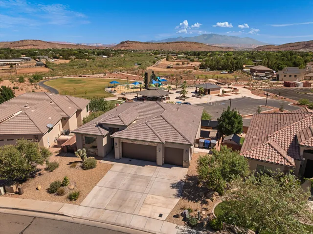 Contemporary stucco exterior with a multi-car driveway and an attached two-car garage