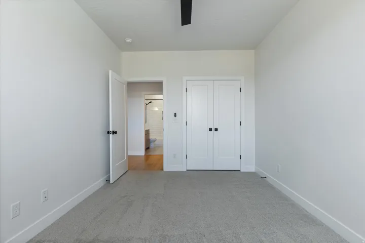 Light gray carpeting with bright white walls and trim