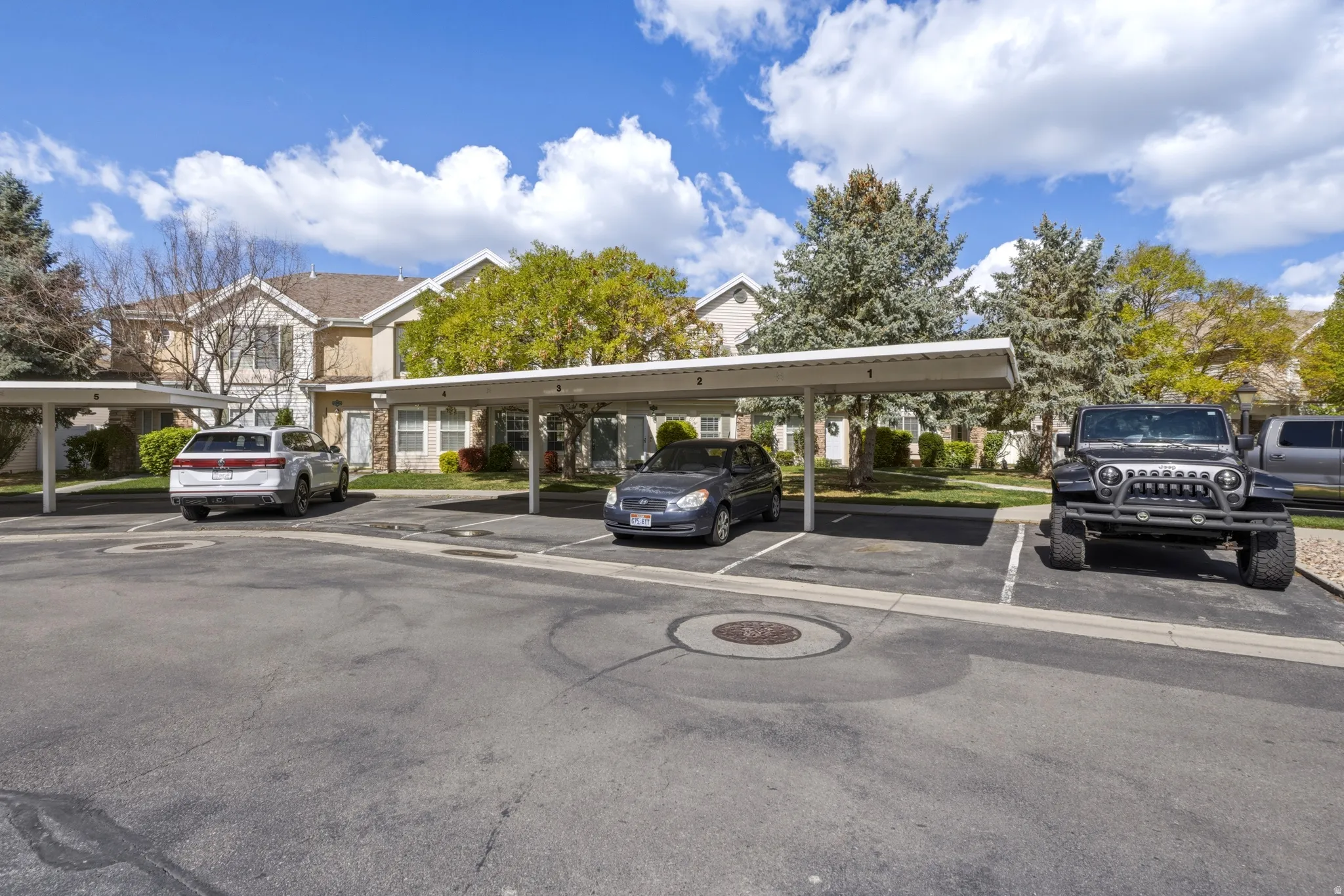 Dedicated covered parking spaces with asphalt surfacing
