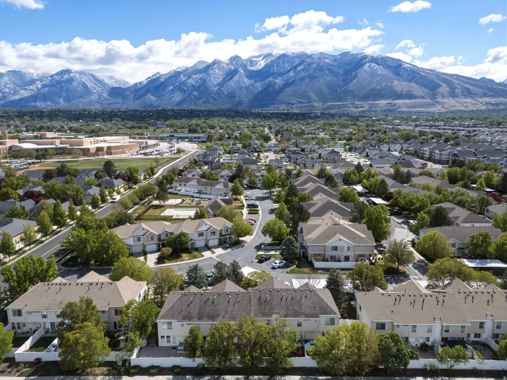 Neighborhood panorama with snow-capped mountain backdrop