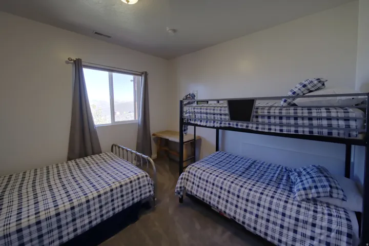 Room with light-toned walls and wood-finish flooring