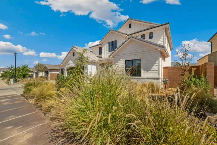 Contemporary exterior with white horizontal siding and board-and-batten accents