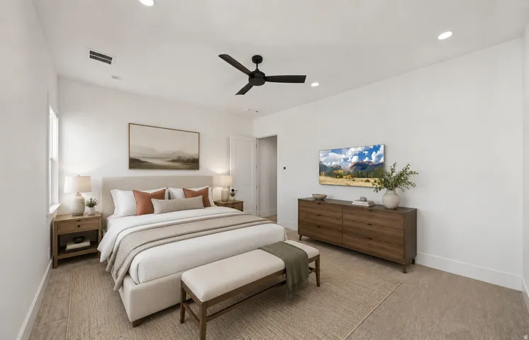 Bright bedroom featuring recessed lighting, a ceiling fan, and wood-finish flooring