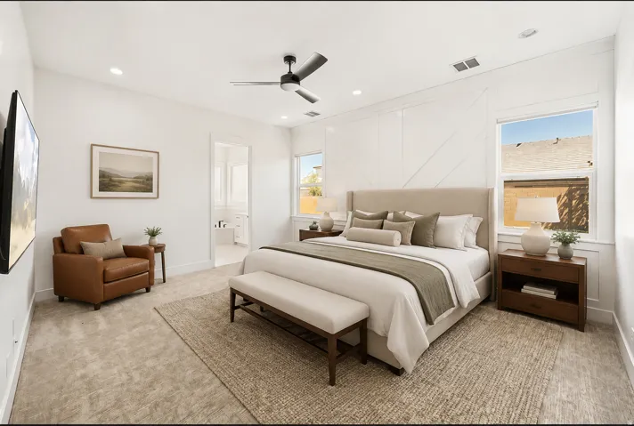 Bright bedroom with recessed lighting and a ceiling fan