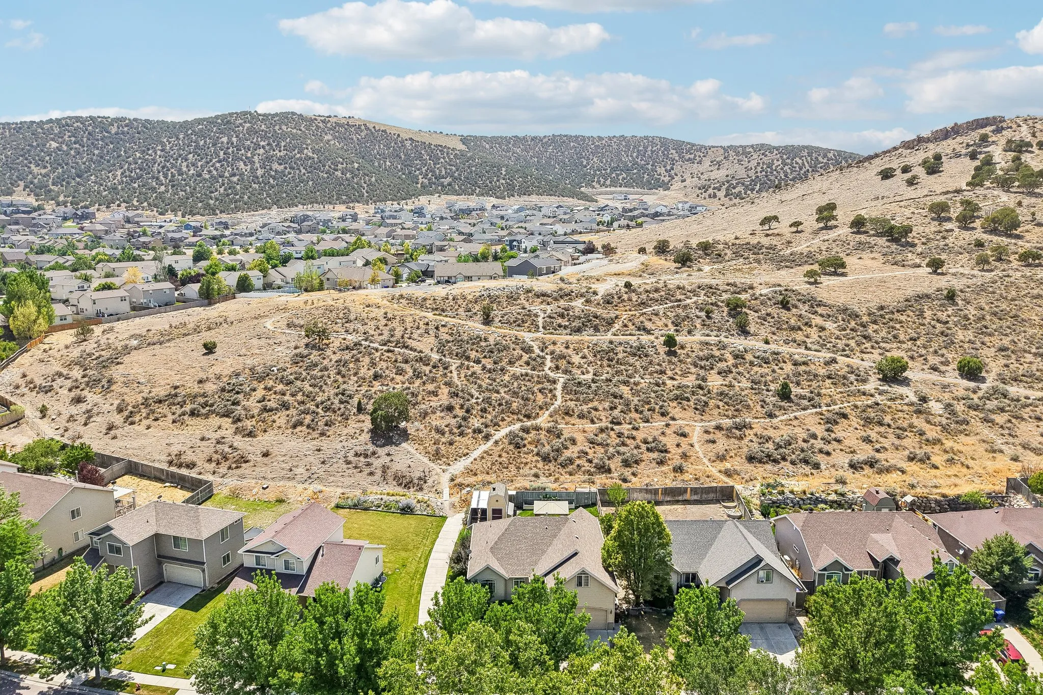 Expansive natural terrain surrounding residential properties