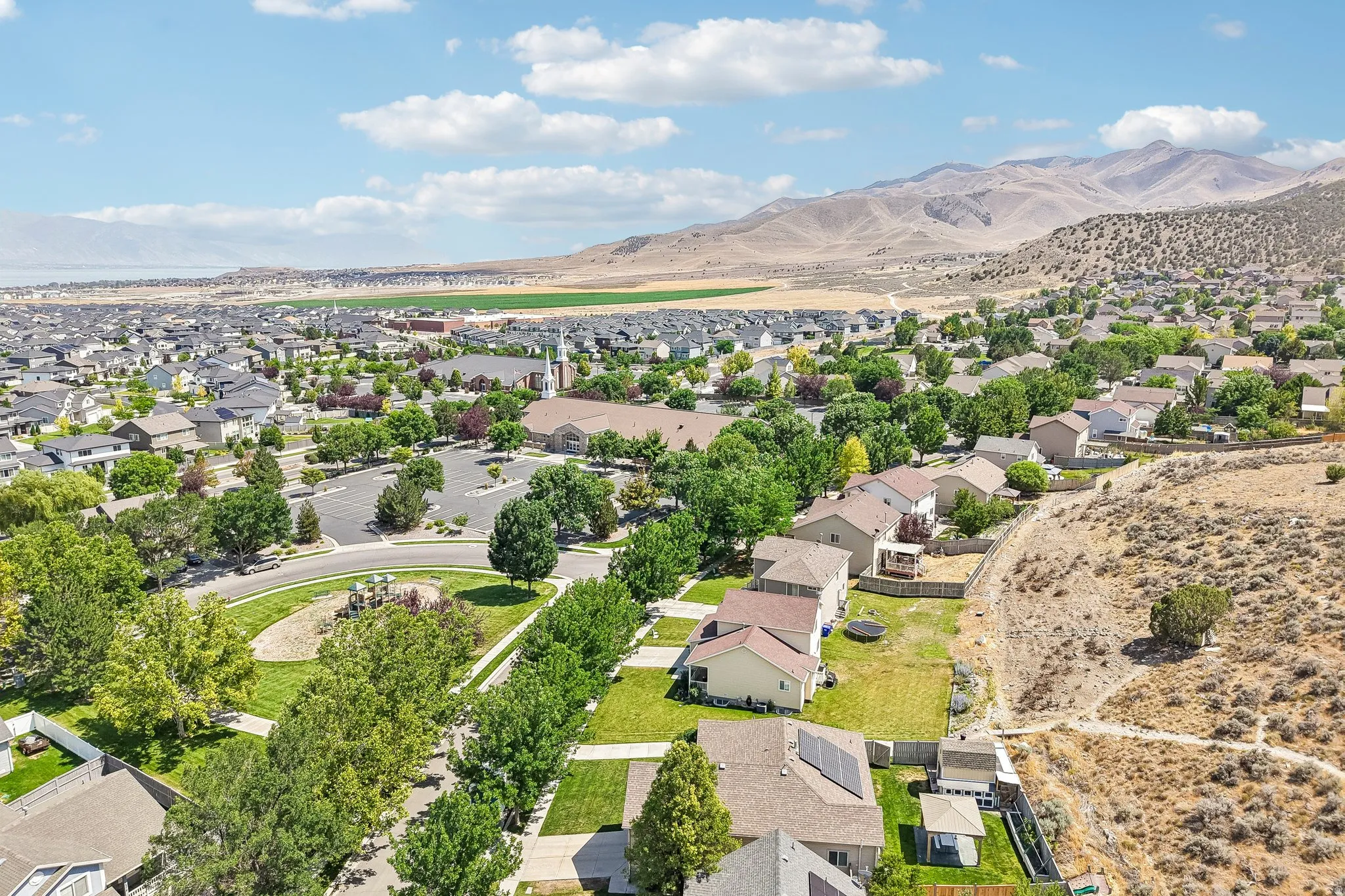 Expansive aerial perspective showcasing a residential development with varied housing styles
