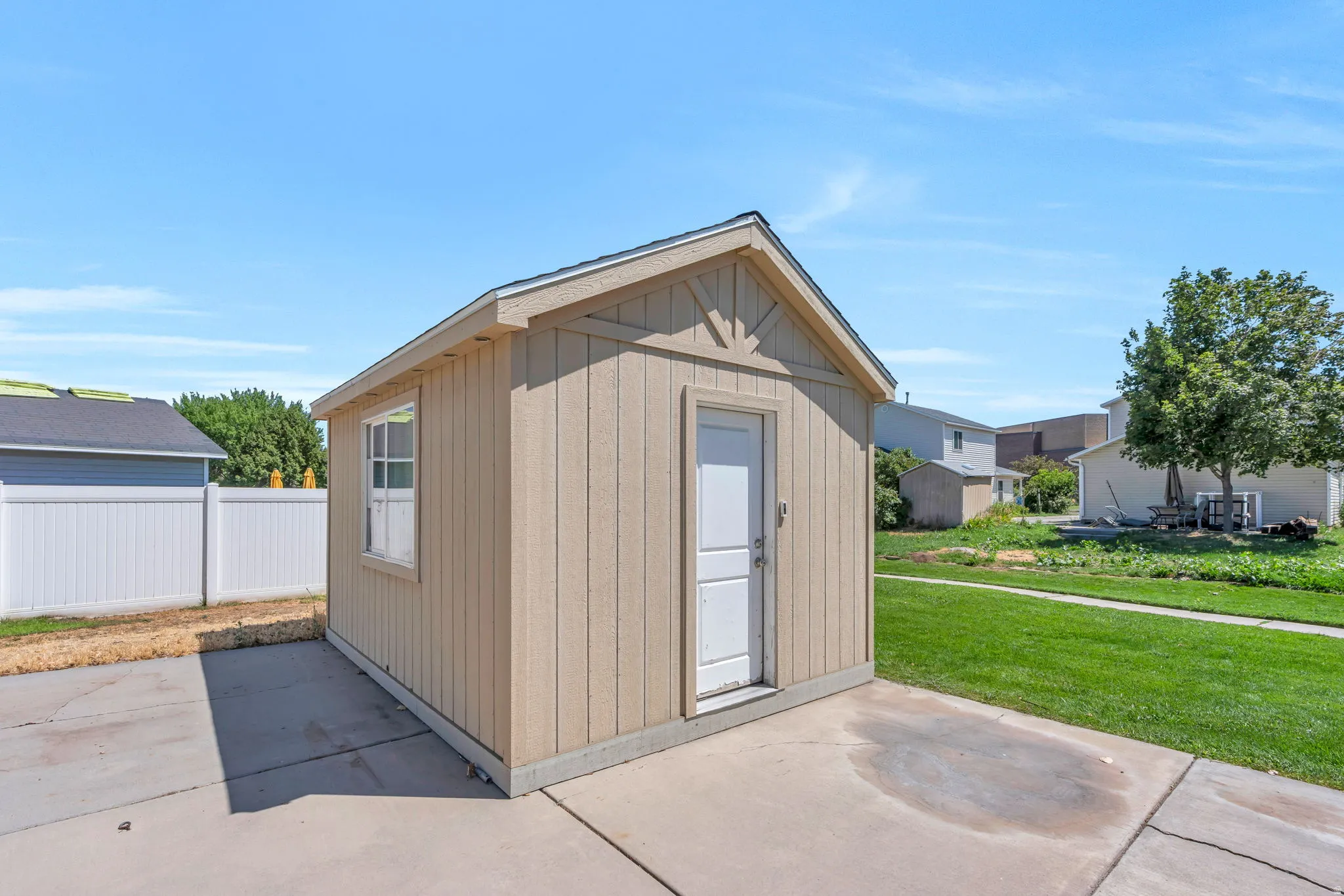 Detached outdoor storage shed with board-and-batten siding and a gable roof