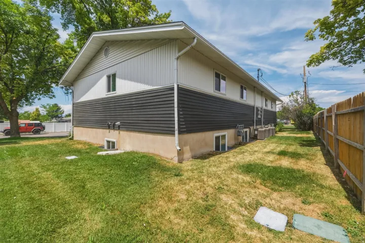 Two-story exterior with a contrasting dark and light horizontal siding design