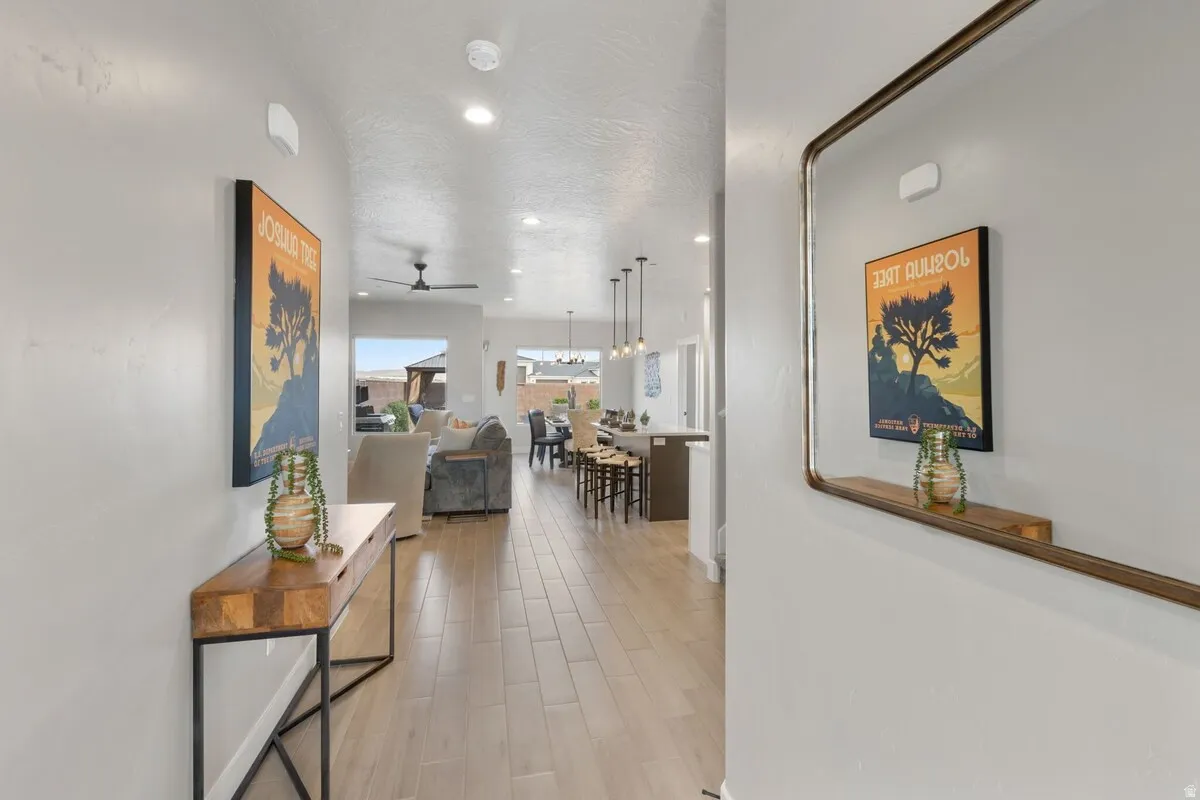 Entryway with wood-finish flooring extending into the open-concept living space