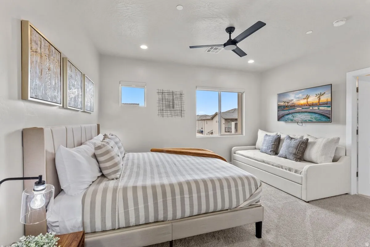 Bright interior space featuring light-colored walls and soft carpet flooring